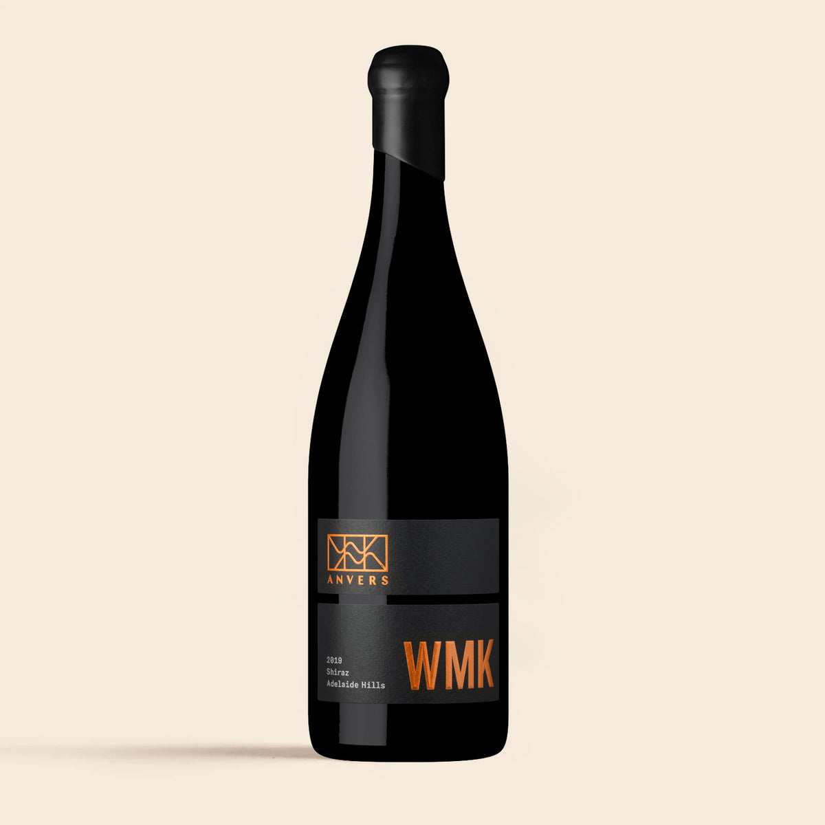 A bottle of 2019 WMK Adelaide Hills Shiraz wine with a black label and orange text.