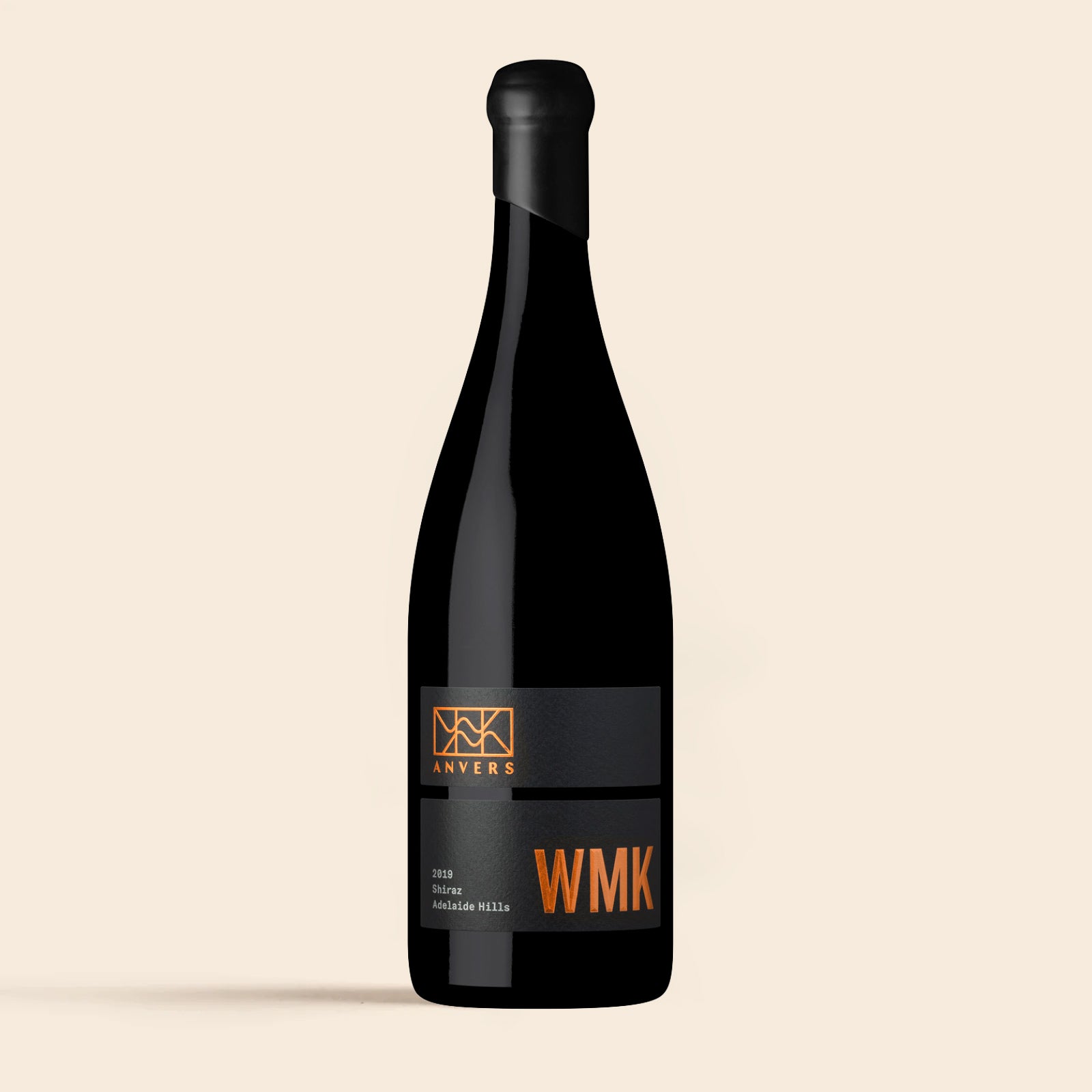 A bottle of 2019 WMK Adelaide Hills Shiraz wine with a black label and orange text.