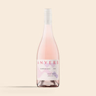 A bottle of 2025 Razorback Road Syrah Rosé wine with a pink label that matches the wine's color.